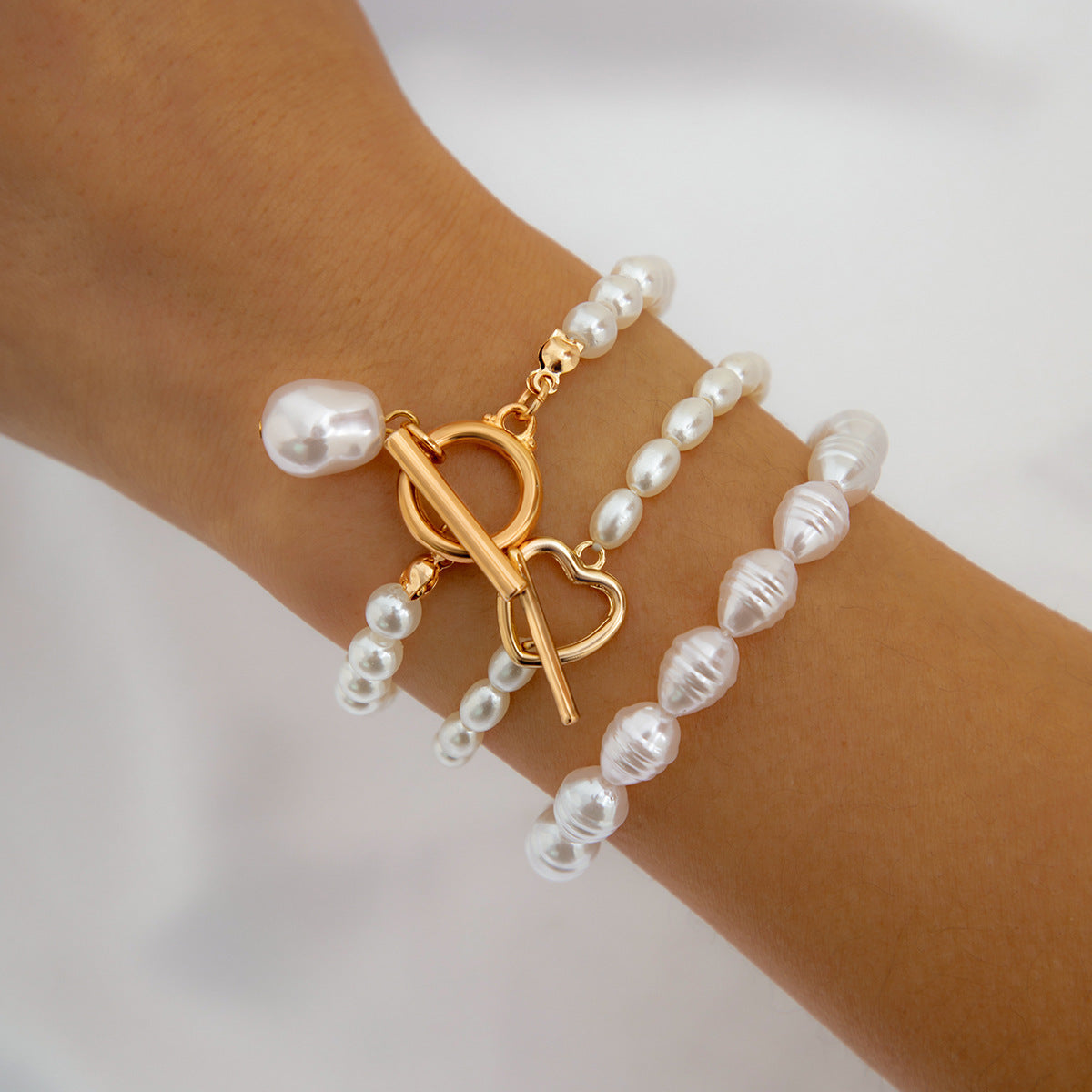 Conjunto de Pulseras Infinity con Perlas