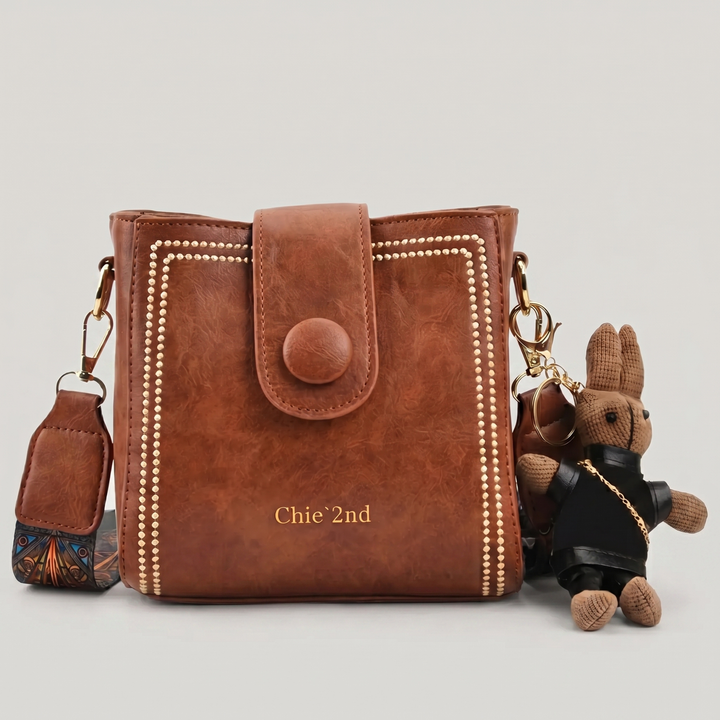 Bolso tipo Satchel + Muñeco Arion de regalo