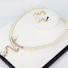 Conjunto de collar y aretes con perlas naturales - Raúl & Sara Madrid