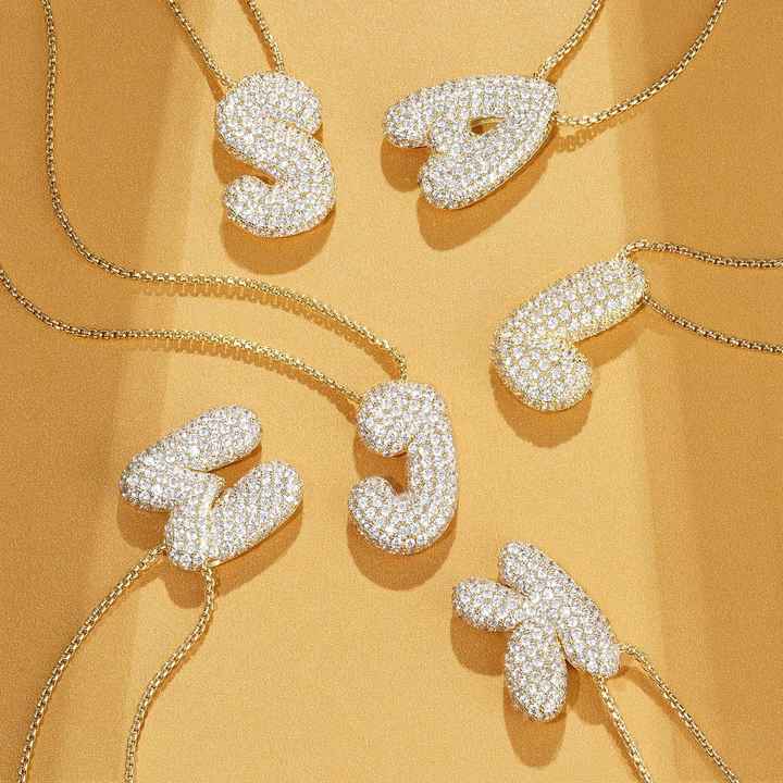 Melanie – Doble corazón en collar dorado