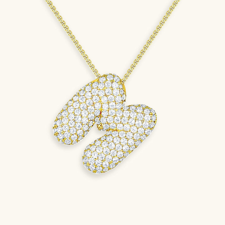 Melanie – Doble corazón en collar dorado