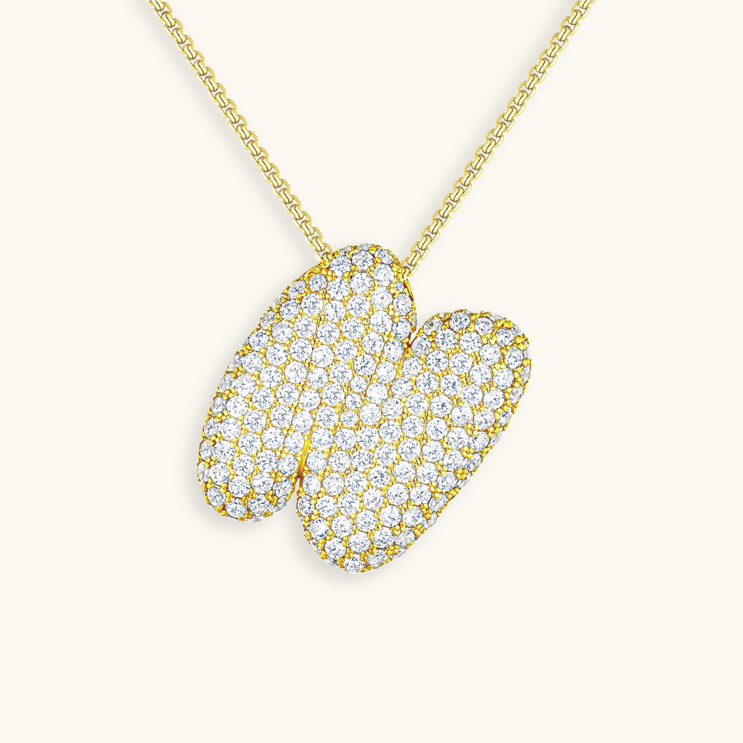 Melanie – Doble corazón en collar dorado