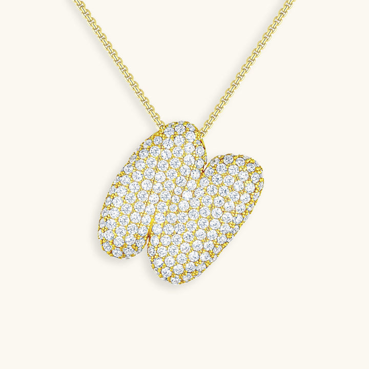 Melanie – Doble corazón en collar dorado