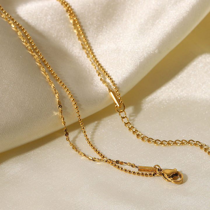 Helena – Delicate Gold Necklace with Geometric Pendant.