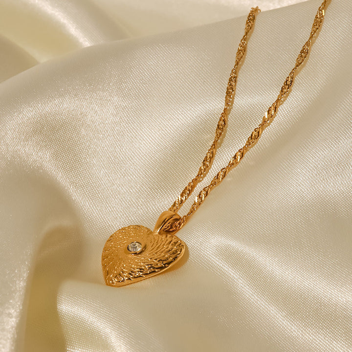 Elisabeth – Collar dorado con encantos simbólicos