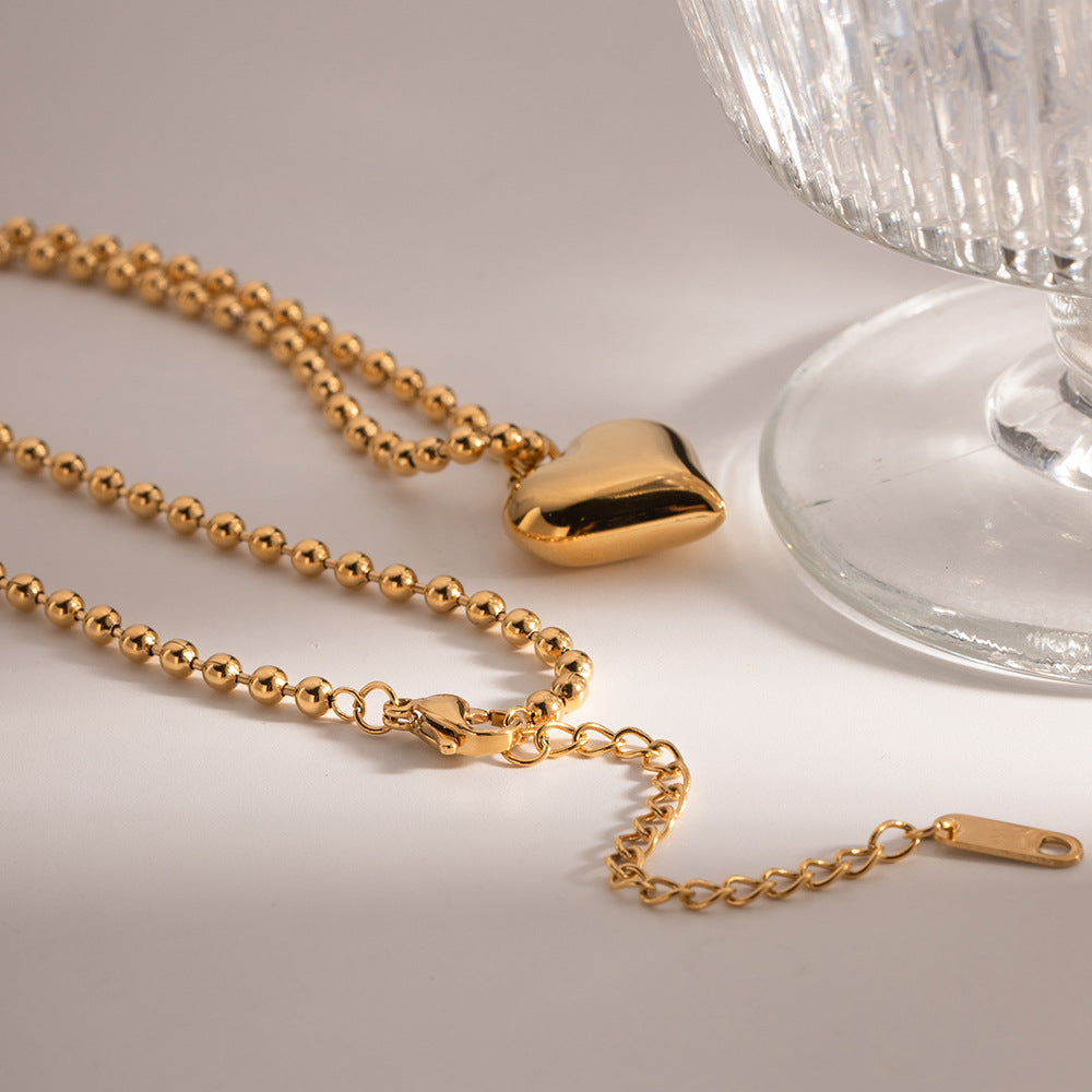 Collar dorado con colgante moderno - Raúl & Sara Madrid
