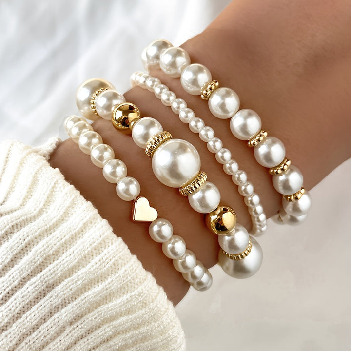 Juego de sofisticadas pulseras en forma de corazón con perlas