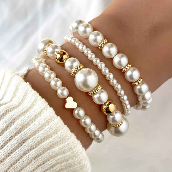 Juego de sofisticadas pulseras en forma de corazón con perlas