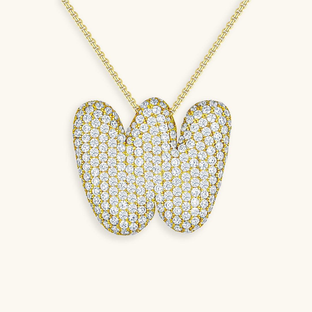 Melanie – Doble corazón en collar dorado