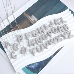 Collar con colgantes de letras - Raúl & Sara Madrid