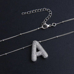 Collar con colgantes de letras - Raúl & Sara Madrid
