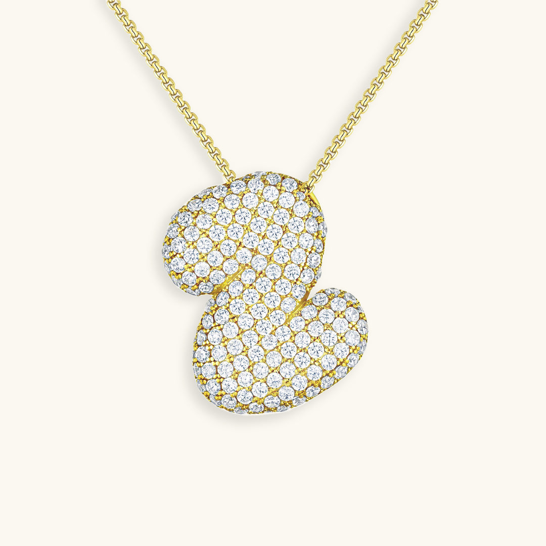 Melanie – Doble corazón en collar dorado