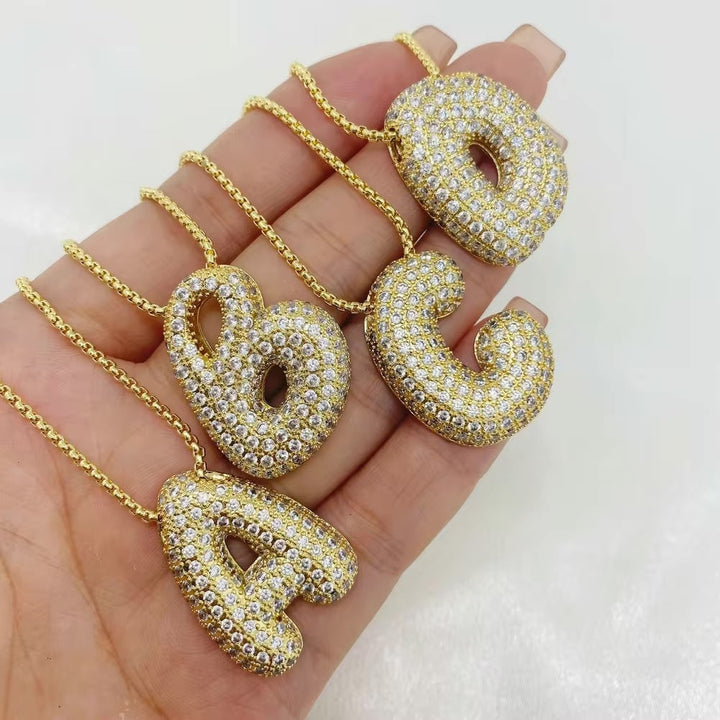 Melanie – Doble corazón en collar dorado