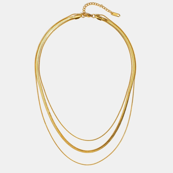 Antonie – Collar de oro de múltiples capas con diseño transparente.