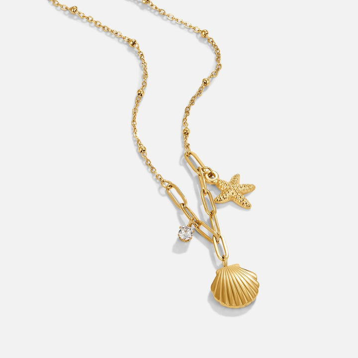 Greta – Cadena con colgante de estrella en tono dorado.