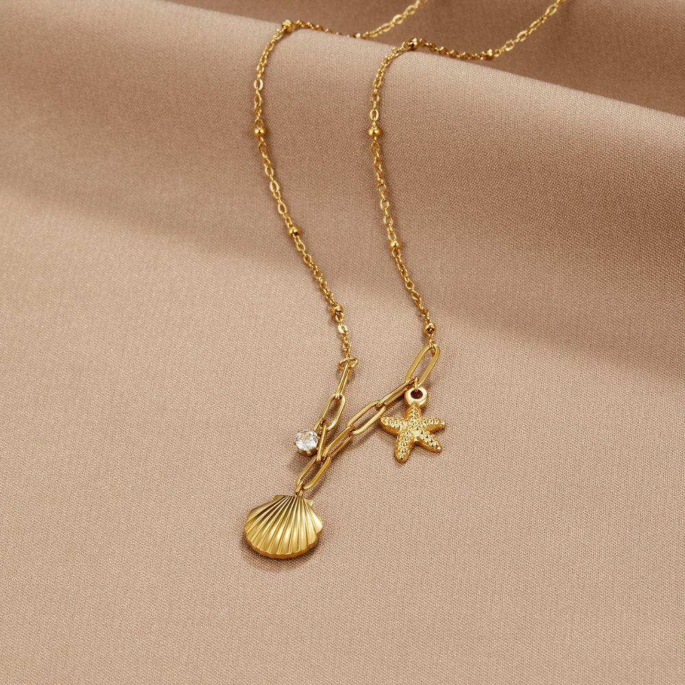 Greta – Cadena con colgante de estrella en tono dorado.