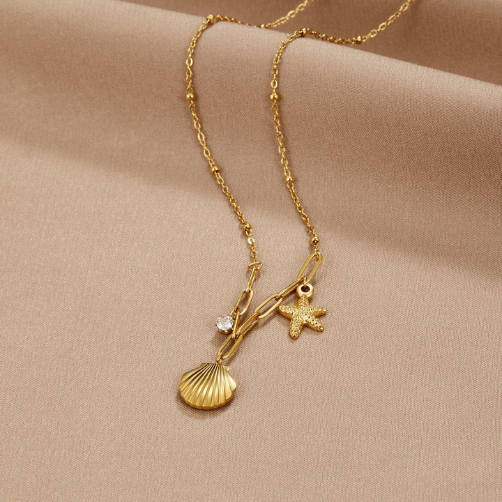 Greta – Cadena con colgante de estrella en tono dorado.