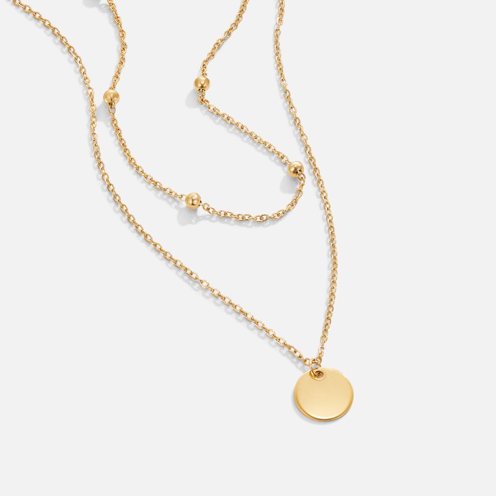 Leona – Doppia collana dorata con pendente rotondo