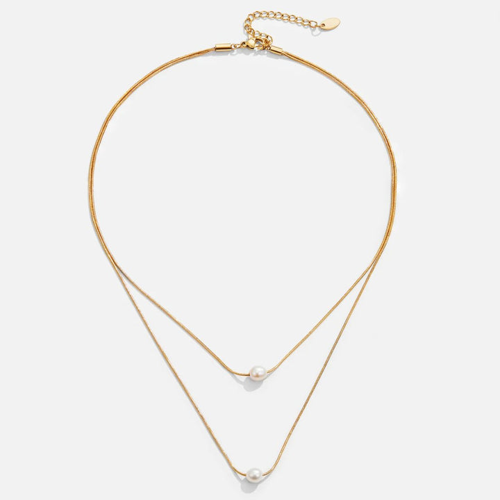 Nora – Collana dorata con design a catena