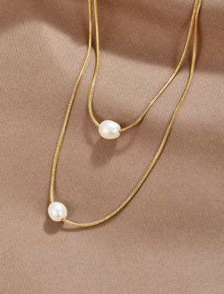 Doble capa de collar dorado con piedra oscura - Raúl & Sara Madrid