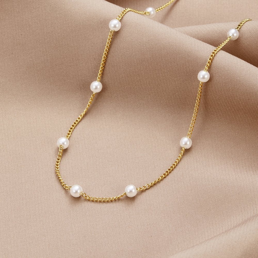 Klara – Doble collar dorado con detalles de perlas